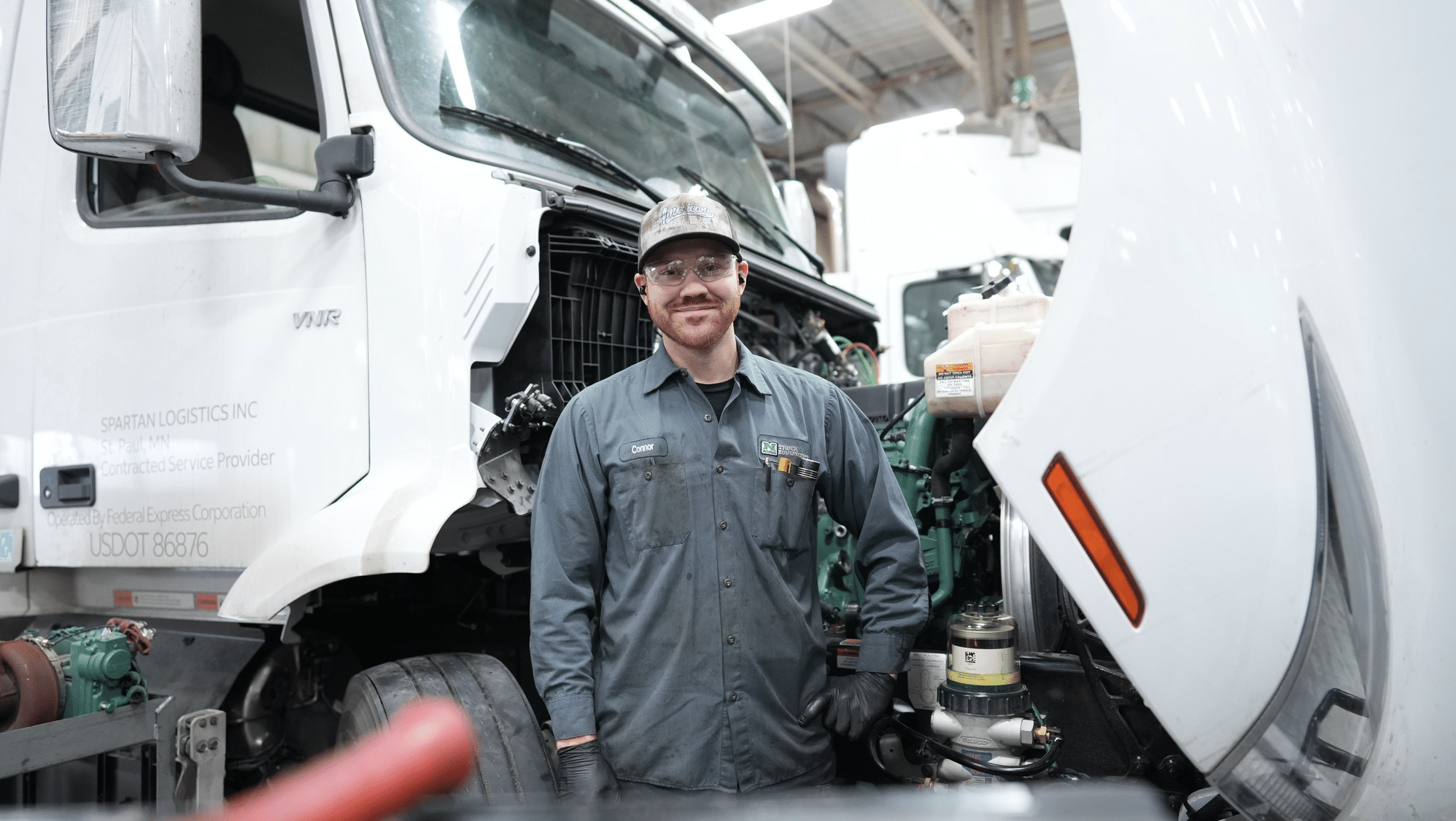 Nuss Truck & Equipment diesel technician working on a heavy-duty truck